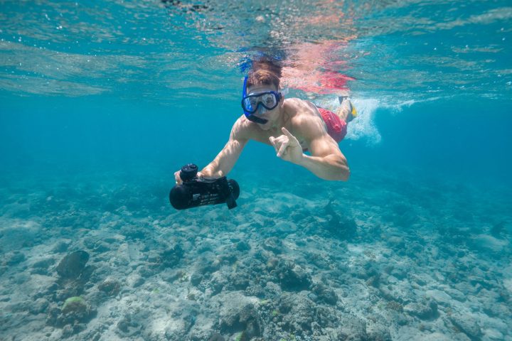 a man swimming in a body of water