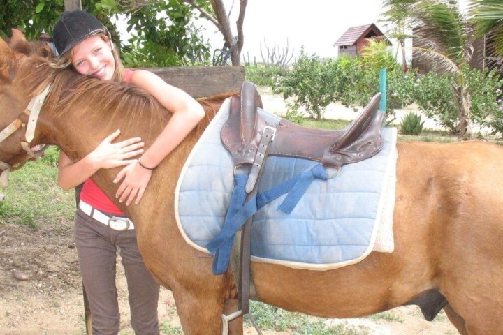 A woman and a horse.