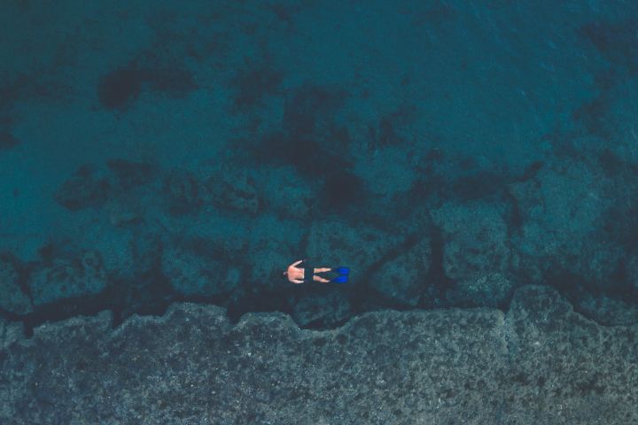 A man snorkeling in the ocean.