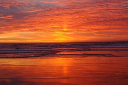 a sunset over a body of water