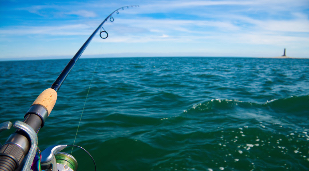 Best Time To Fish In Aruba a small boat in a body of water